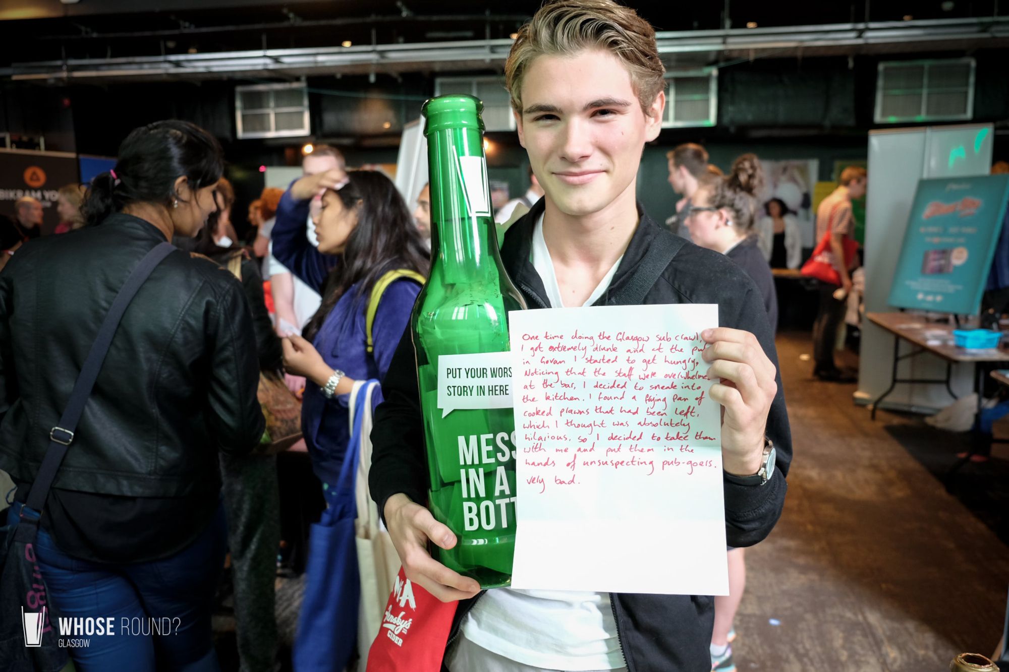Young adult holding alcohol related message and a plastic bottle